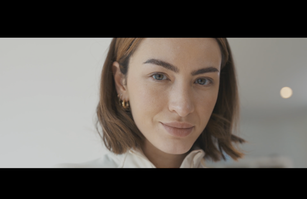 A photographic still from the short film Vive Libre Ou Mourir. The photo shows a women looking directly into the camera.