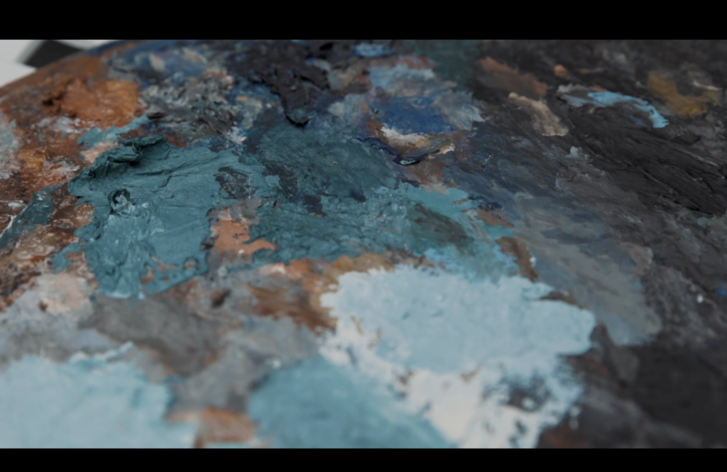 A photographic still from the short film The Artist. The photo shows the oil painters palette.